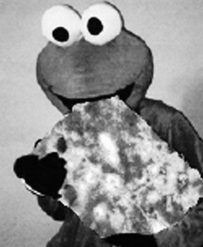 cookie monster eating a "Basler Läckerli"